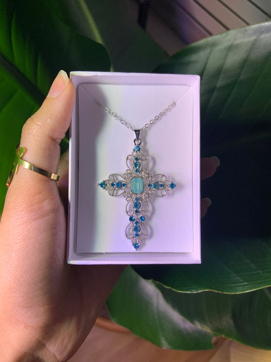 Detailed silver and blue cross necklace